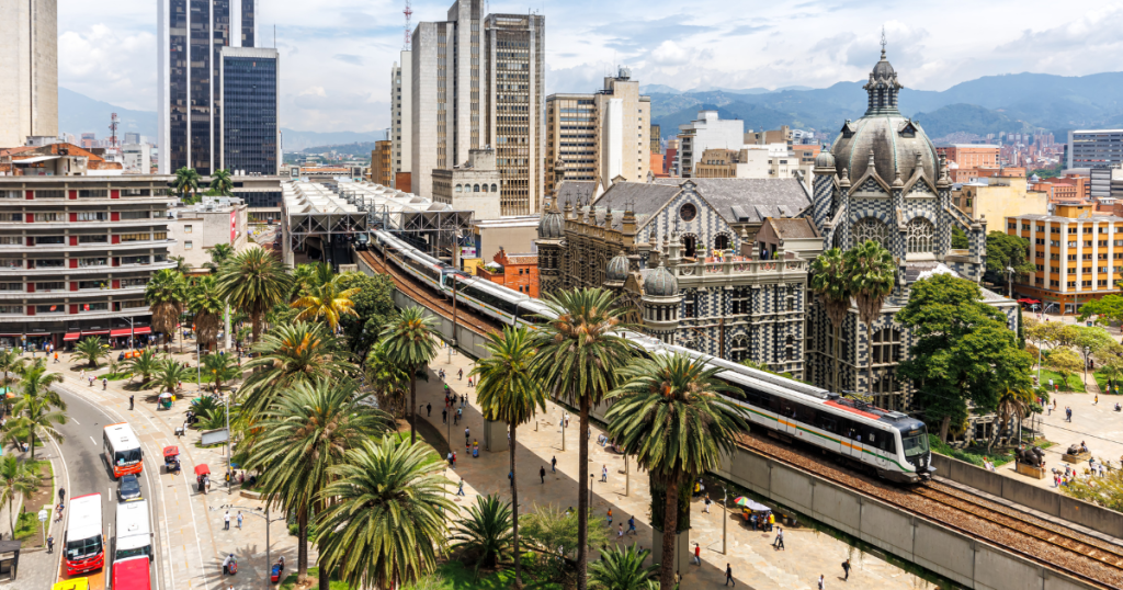 Imagae of Medellin with train leaving station in one of the best cities to learn Spanish in Latin America