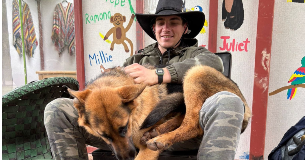 Volunteer at Cusco wildlife center with a rescued dog