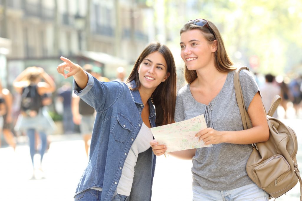 Woman speaking with other woman asking for directions