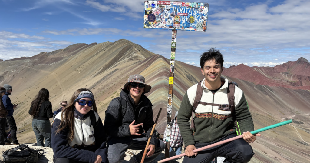 Volunteers reach top of Rainbow Mountain.