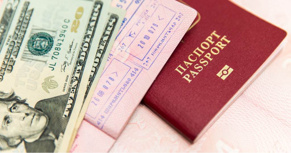 Dollar bills and a passport