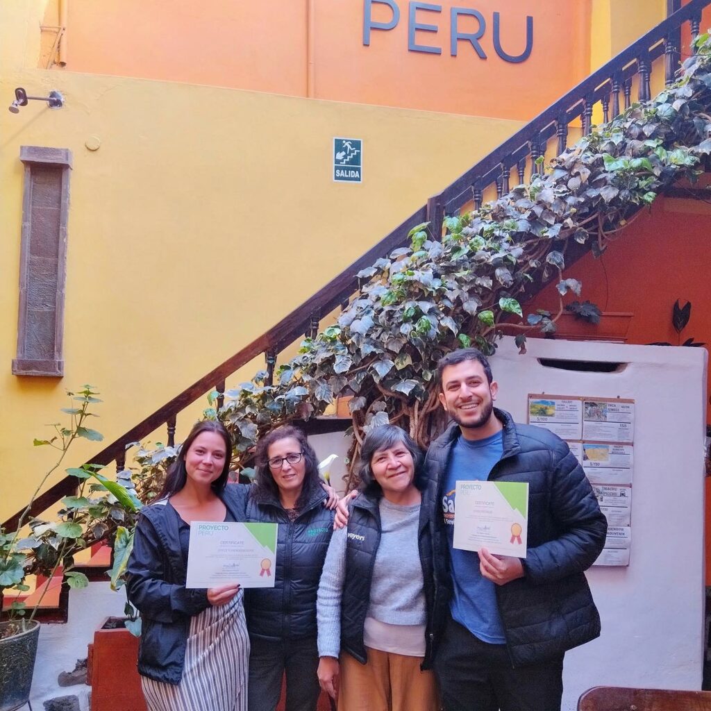 Spanish immersion in Cusco students receive their graduation certificates at proyecto Peru