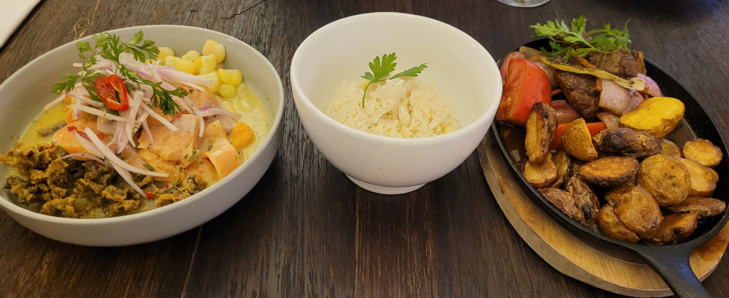 Trout ceviceh and Lomo Saltado served with a bowl of rice