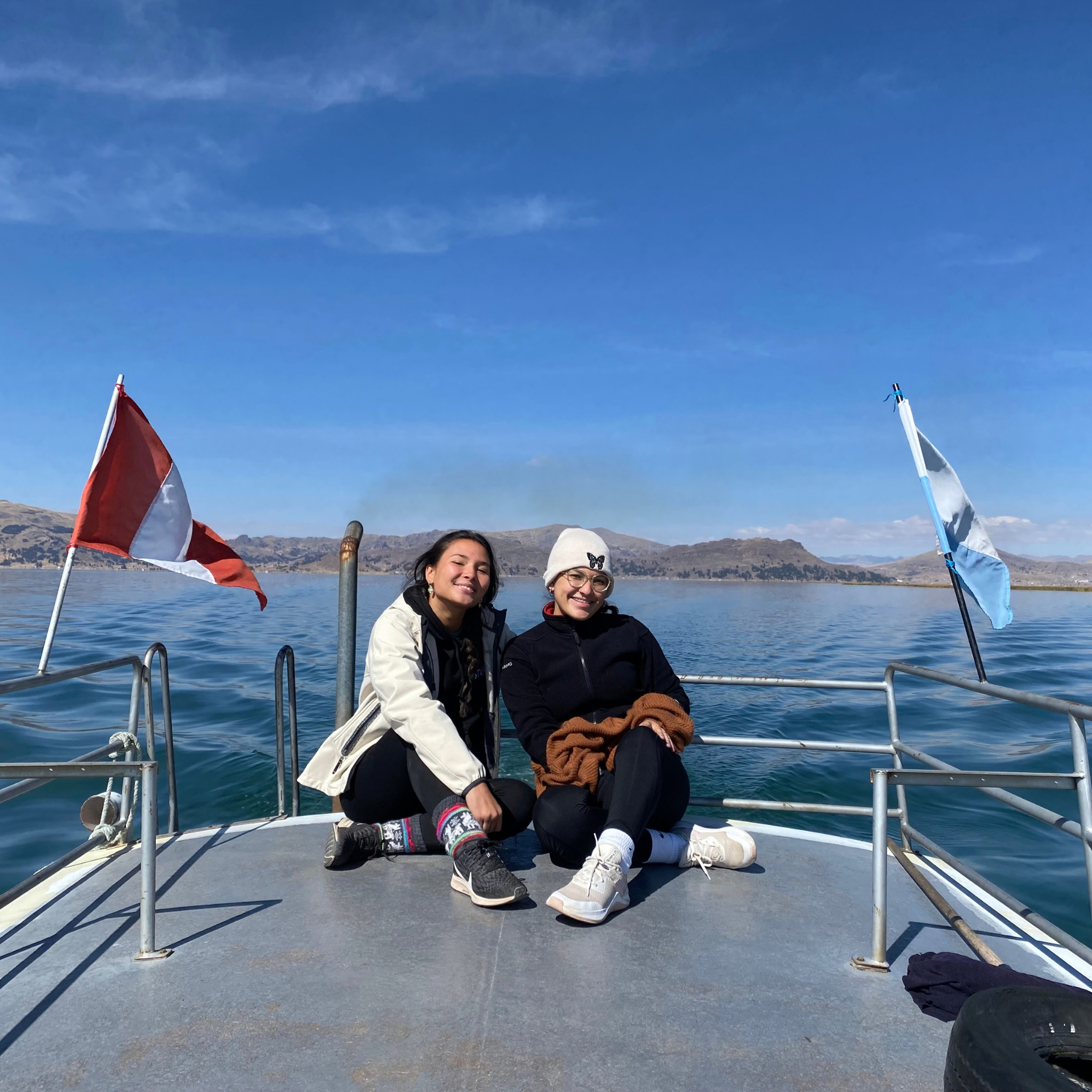 Two women on a boat on the Lake Titicaca tour